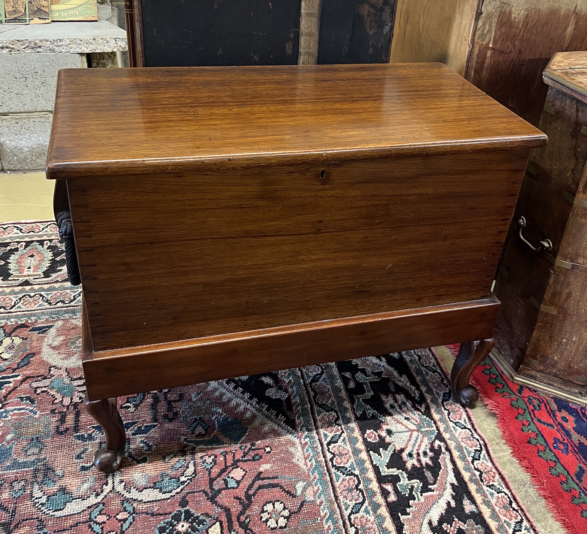 A 19th century hardwood seaman's chest on associated stand, width 89cm, depth 45cm, height 72cm together with an inlaid cigarette box